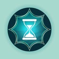 Timer sand hourglass icon magical glassy sunburst blue button sky blue background Royalty Free Stock Photo