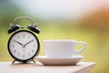 Times of coffee with alarm clock on the table Royalty Free Stock Photo