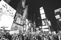 Times Square with lots of visitors at night in New York City