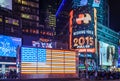 Illuminated USA Flag in New York Times Square at Night. Animated LED Screens and Bright Lights. Royalty Free Stock Photo