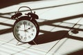 Times vintage clock in shade light and shadow art still life Royalty Free Stock Photo