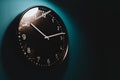 Timing concept in home black clock hand on dark wall Royalty Free Stock Photo
