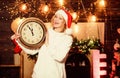 timing. happy new year. christmas preparation. girl in red santa claus hat. Midnight. Cheerful woman.. Time to celebrate Royalty Free Stock Photo