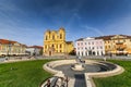 Timisoara - The Catholic Dome in Piata Unirii Union Square with people passing by