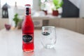 Strongbow bottle and glass on a wooden table