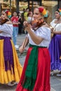 Young Mexican singer on the violin in traditional costume