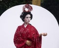 Timisoara, Romania- 09.06.2019 Living statue of a Japanese geisha. Woman dressed in kimono pose as a realistic human