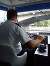 Timisoara / Romania - October 13, 2019: the captain of the ship sits in a white chair and controls the ship. River boat passes