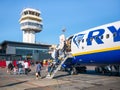 People getting off from a Ryanair plane at TimiÃâ¢oara Traian Vuia International Airport