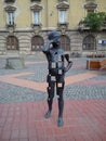 Timisoara / Serbia - October 24, 2019: volumetric metal sculpture of a boy with square holes talking on a cell phone. One hand on Royalty Free Stock Photo