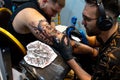Timisoara,Timis Romania,April 24 2023: Close up of the tattoo machine. Tattooing. professional tattoo artist