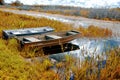 Boats on a river shore autumn in the swamps Royalty Free Stock Photo