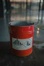 Tin bucket with toxic composition and epoxy resin inside
