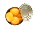 Tin can with conserved peach halves on white background Royalty Free Stock Photo