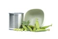 Tin can and fresh garden peas isolated on white Royalty Free Stock Photo