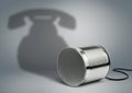 Tin can with telephone shadow, communication creative concept