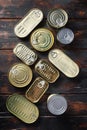 Tin cans food set top view on dark wood rustic background top view Royalty Free Stock Photo