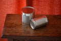 Two empty tin cans on a table. Royalty Free Stock Photo