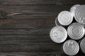 Tin cans on wooden background, top view. Recycling garbage Royalty Free Stock Photo