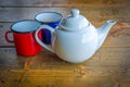 Tin coffee mugs and teapot Royalty Free Stock Photo