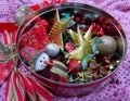 Red tin container with Christmas decorations Royalty Free Stock Photo