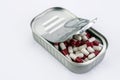 Tin metal contains white pills and red Royalty Free Stock Photo