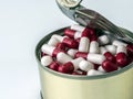 Tin metal contains white pills and red Royalty Free Stock Photo