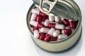 Tin metal contains white pills and red Royalty Free Stock Photo