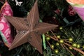 Tin Star Ornament on Christmas Tree Royalty Free Stock Photo