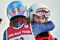 Tina Sutton Memorial. Unidentified participant calming down girl who felt down during junior ski race