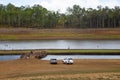 People on exposed old bridge in drought affected Lake Tinaroo on Royalty Free Stock Photo