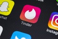 Tinder application icon on Apple iPhone X screen close-up. Tinder app icon. Tinder application. Social media icon. Social network. Royalty Free Stock Photo