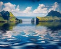 Tindholmur cliffs reflected in the calm waters of Atlantic Ocean Royalty Free Stock Photo