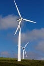 Pico Gallo, Tineo, Asturias, Spain. Two wind turbines with a sky with clouds in the background. Royalty Free Stock Photo