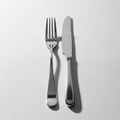 Tines and is placed to the left of the knife which has a smooth blade Royalty Free Stock Photo