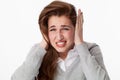 Tinnitus concept, nervous 20s woman suffering from headache grinding teeth