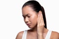 Asian woman having ear pain, white studio background Royalty Free Stock Photo