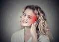 Tinnitus. Sick female having ear pain touching her painful head Royalty Free Stock Photo