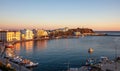 Tinos island Hora at sunset Cyclades Greece. Aerial drone view of port, golden sea and building Royalty Free Stock Photo