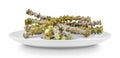 Tinospora cordifolia herb in plate isolated on white background Royalty Free Stock Photo