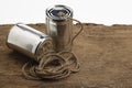Tins cup telephone with rope connecting on wooden background Royalty Free Stock Photo