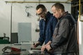 A tinsmith and his fellow colleague engineer Royalty Free Stock Photo