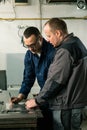A tinsmith and his fellow colleague engineer Royalty Free Stock Photo