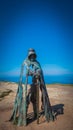King Arthur sculpture with beautiful Cornish landscape in Tintagel, UK Royalty Free Stock Photo