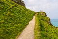 View of Tintagel Island and legendary Tintagel castle. Royalty Free Stock Photo