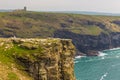 View of Tintagel Island and St Materiana`s church in the background.