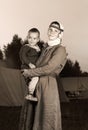 Tinted antique portrait of a slavic woman with a child in costumu history