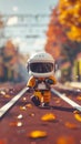 A Tiny Astronaut in Orange Space Suit Strolling on a Train Track in Autumn Royalty Free Stock Photo