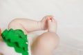 Tiny Babies Feet on White Blanket. Close up of Small Bare Feet of Baby Infant Royalty Free Stock Photo