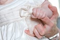 Tiny baby hand holding mothers finger Royalty Free Stock Photo